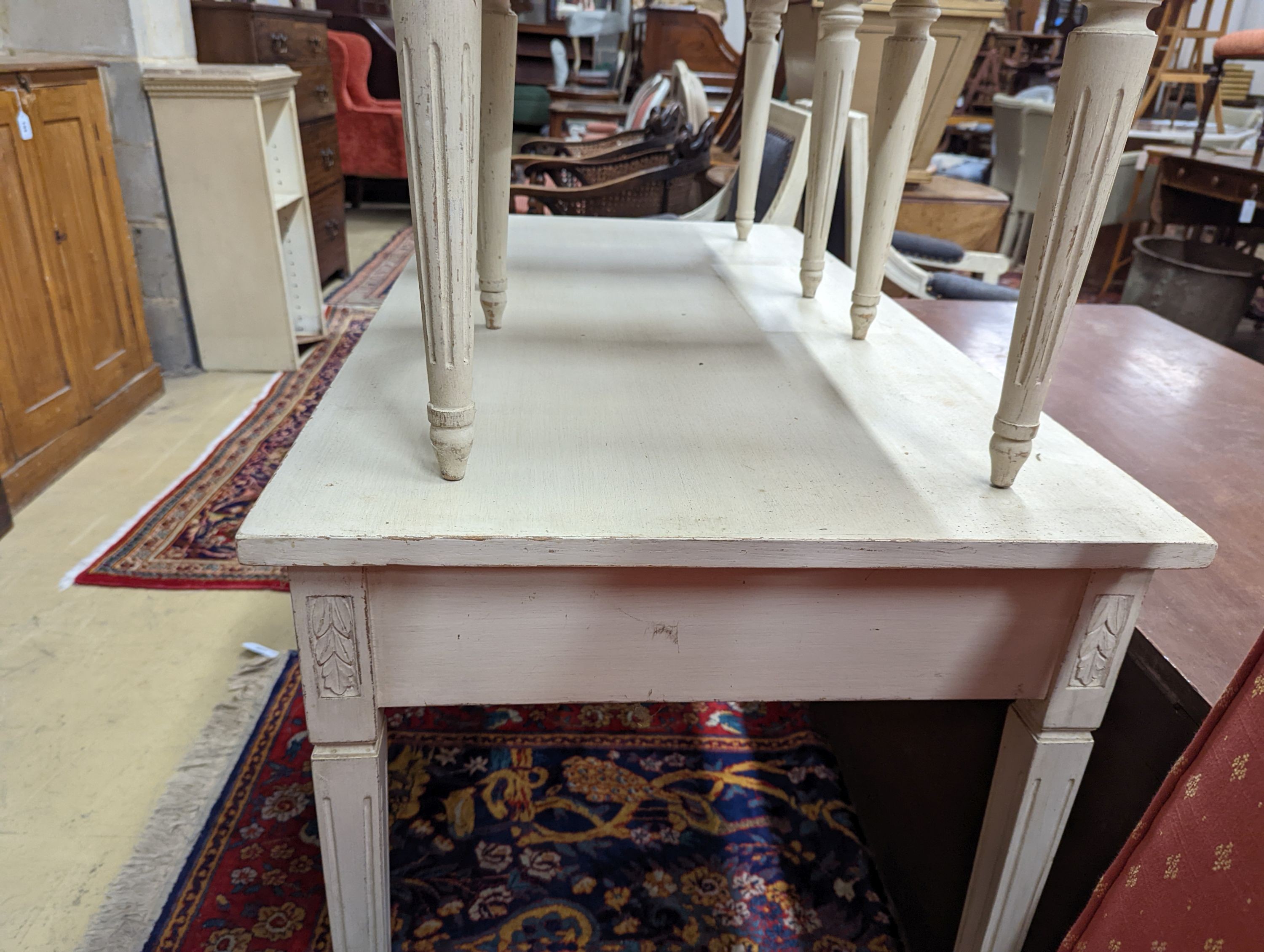 A rectangular painted dressing table, width 110cm, depth 60cm, height 75cm, together with two painted dressing stools